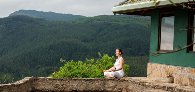 woman-is-doing-yoga-exercises-in-mountains